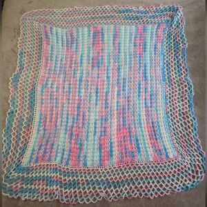 Vintage Handmade Crochet Blanket Featuring pastel pink, blue, and white colours
